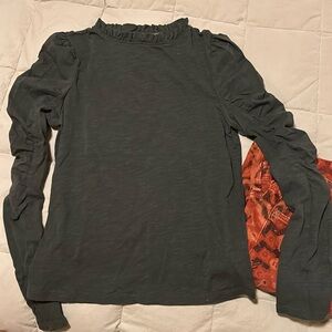 Knit top with “ruffled” long sleeve